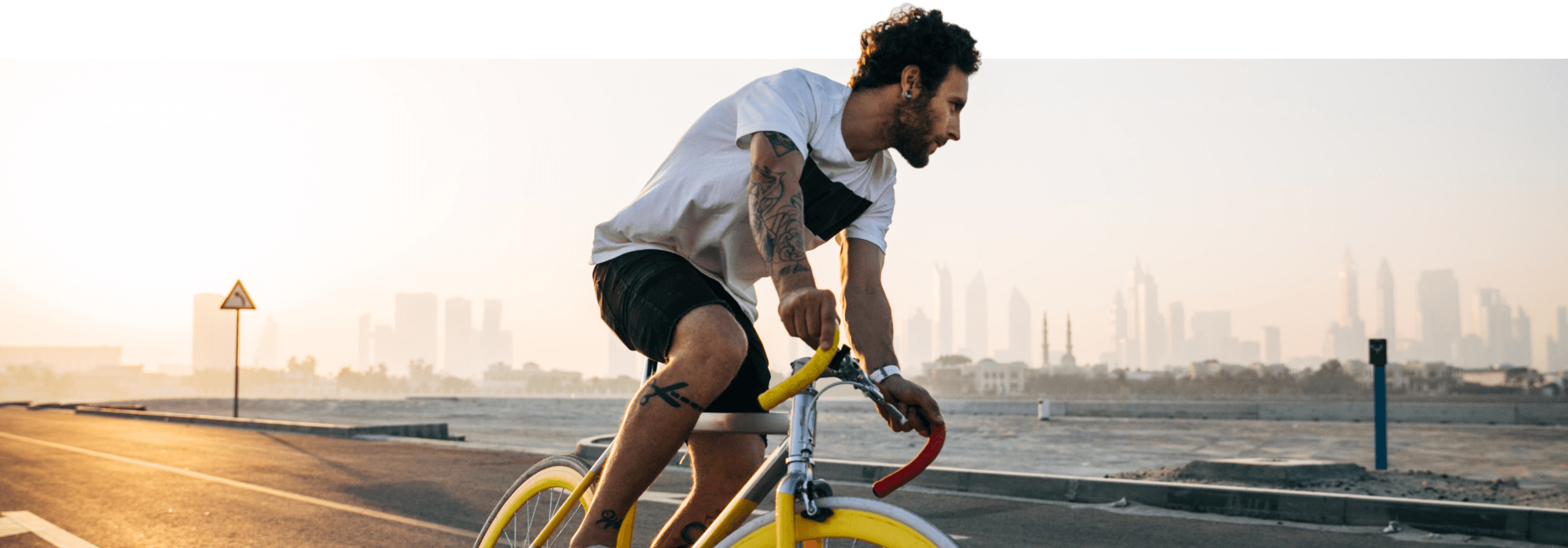 A man rides a bicycle through nature