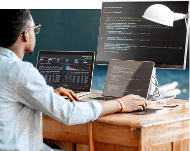 Man with three computers