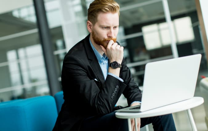 Businessman thoughtfully considering his options